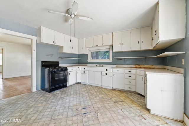 5901 E Short Ave, Globe, AZ 85501 - kitchen featuring black gas range oven, ceiling fan, white cabinets, and light countertops