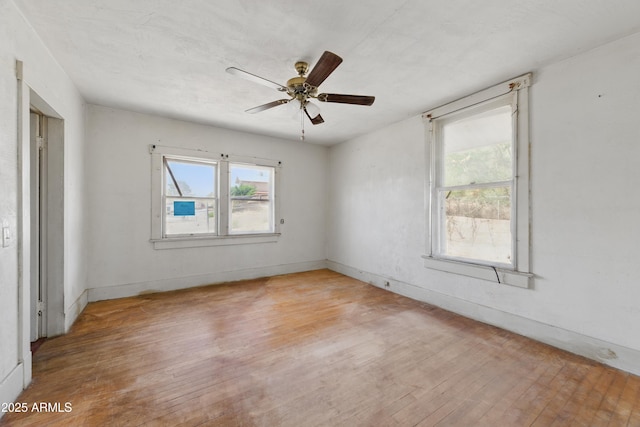 5901 E Short Ave, Globe, AZ 85501 - spare room with wood-type flooring, healthy amount of natural light, and ceiling fan