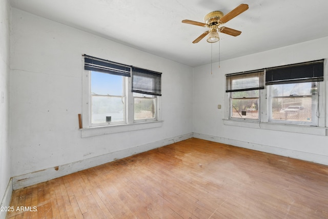 5901 E Short Ave, Globe, AZ 85501 - empty room featuring healthy amount of natural light, light wood finished floors, and a ceiling fan