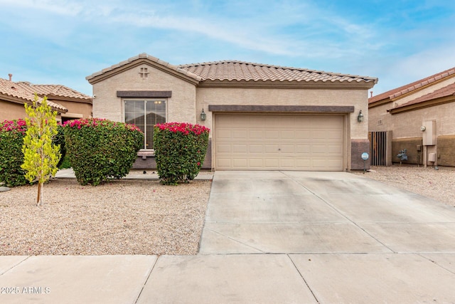 3022 W Redwood Ln, Phoenix, AZ 85045 - mediterranean / spanish house featuring concrete driveway, an attached garage, stucco siding, and a tile roof