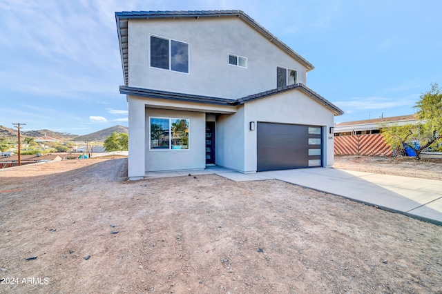 exterior space with a mountain view and a garage