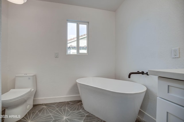 bathroom with tile patterned floors, a bathing tub, and toilet