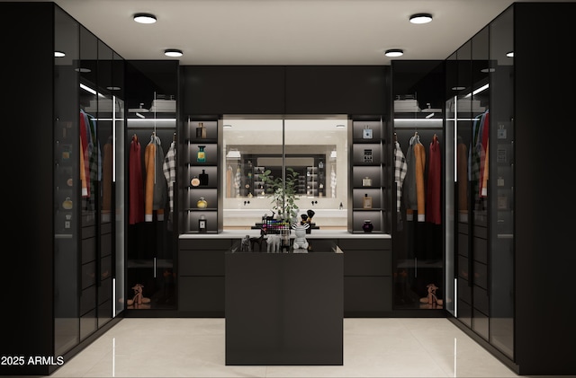 walk in closet featuring light tile patterned floors