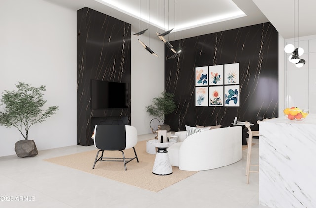 living room featuring tile patterned floors and a tray ceiling