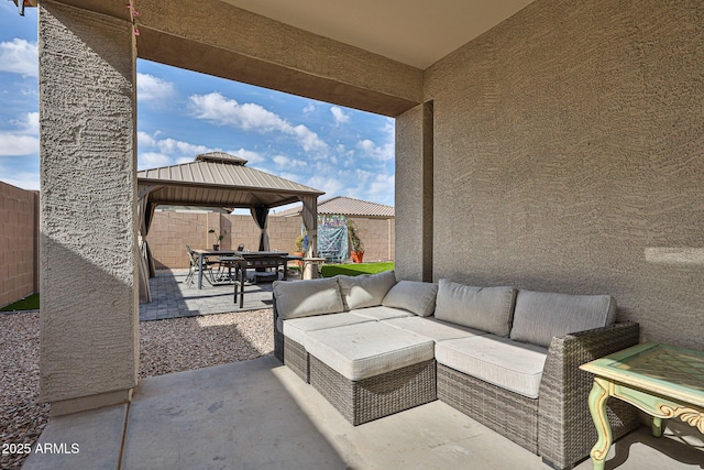 19946 W Glenrosa Ave, Litchfield Park, AZ 85340 - view of patio featuring a fenced backyard, outdoor dining area, a gazebo, and outdoor lounge area