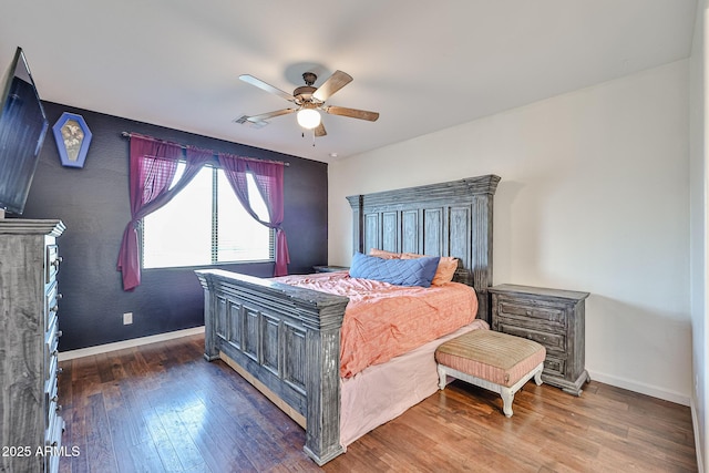 19946 W Glenrosa Ave, Litchfield Park, AZ 85340 - bedroom with baseboards, ceiling fan, visible vents, and hardwood / wood-style floors