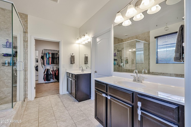 19946 W Glenrosa Ave, Litchfield Park, AZ 85340 - full bathroom featuring a sink, tile patterned floors, a stall shower, and two vanities