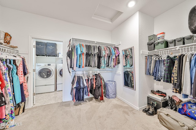 19946 W Glenrosa Ave, Litchfield Park, AZ 85340 - walk in closet featuring carpet floors, attic access, and washing machine and dryer