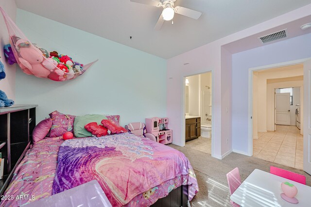 19946 W Glenrosa Ave, Litchfield Park, AZ 85340 - bedroom featuring visible vents, washer / dryer, light carpet, baseboards, and connected bathroom