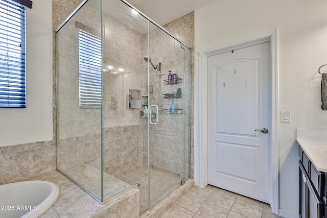 19946 W Glenrosa Ave, Litchfield Park, AZ 85340 - full bathroom with tile patterned flooring, vanity, a garden tub, and a shower stall