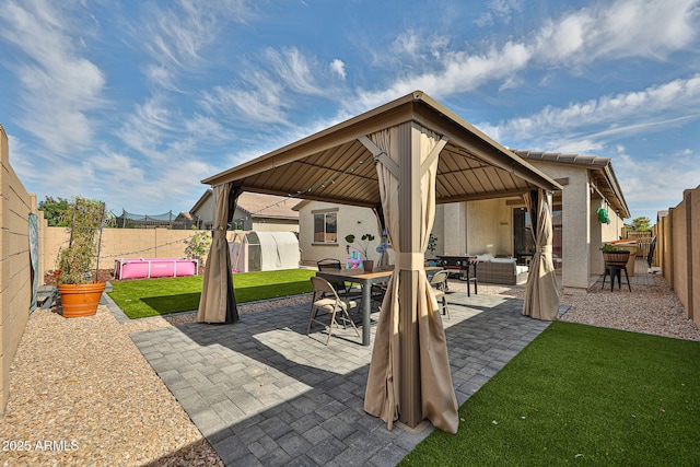 19946 W Glenrosa Ave, Litchfield Park, AZ 85340 - view of patio featuring a gazebo, an outdoor living space, a fenced backyard, and outdoor dining space