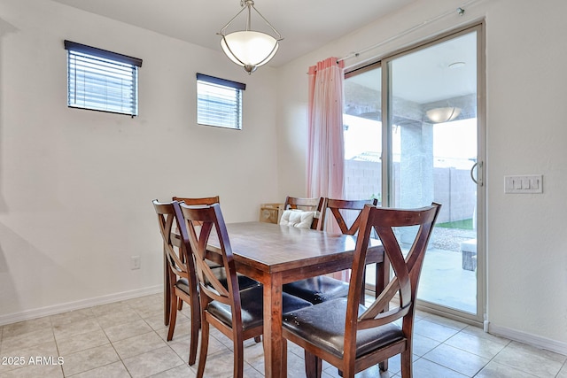 19946 W Glenrosa Ave, Litchfield Park, AZ 85340 - dining room with baseboards and light tile patterned flooring