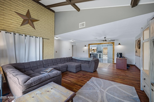 2921 N 103rd Ave, Avondale, AZ 85392 - living area featuring high vaulted ceiling, wood finished floors, beamed ceiling, and a ceiling fan