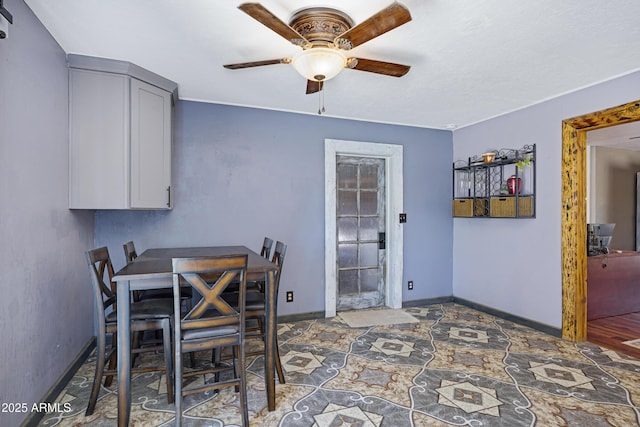 2921 N 103rd Ave, Avondale, AZ 85392 - dining space with a ceiling fan and stone finish floors