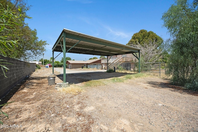 2921 N 103rd Ave, Avondale, AZ 85392 - view of parking / parking lot with a carport, stairway, and driveway