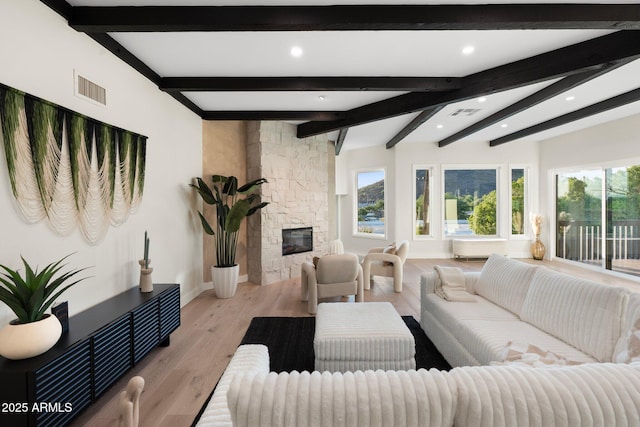 908 W Pershing Ave, Phoenix, AZ 85029 - living room with healthy amount of natural light, recessed lighting, light wood-type flooring, a fireplace, and beamed ceiling