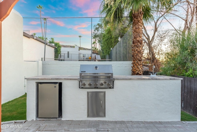 908 W Pershing Ave, Phoenix, AZ 85029 - view of patio with exterior kitchen and a sink