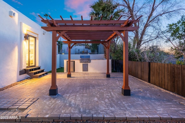908 W Pershing Ave, Phoenix, AZ 85029 - patio terrace at dusk featuring area for grilling, a pergola, and a patio area