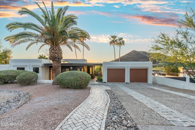 908 W Pershing Ave, Phoenix, AZ 85029 - view of front of property featuring driveway, a garage, and stucco siding