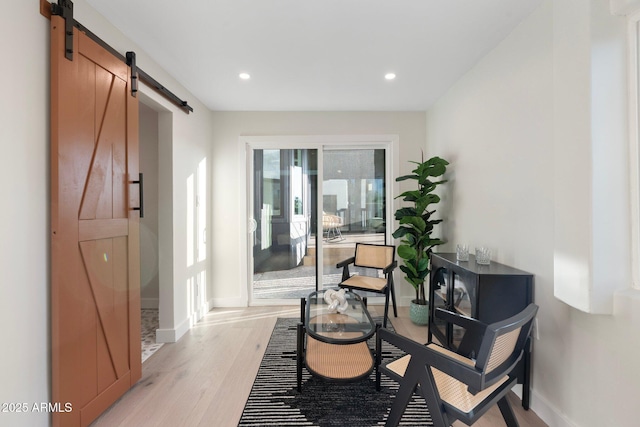 908 W Pershing Ave, Phoenix, AZ 85029 - living area featuring a barn door, light wood-style flooring, and recessed lighting