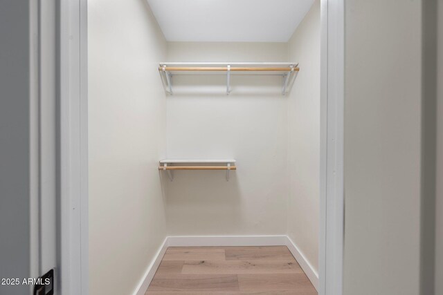 908 W Pershing Ave, Phoenix, AZ 85029 - walk in closet with wood finished floors