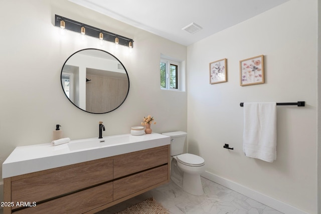 908 W Pershing Ave, Phoenix, AZ 85029 - bathroom featuring vanity and marble finish flooring