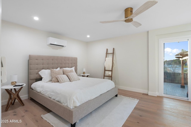 908 W Pershing Ave, Phoenix, AZ 85029 - bedroom with a wall unit AC, access to exterior, light wood finished floors, recessed lighting, and a ceiling fan