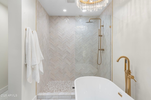 908 W Pershing Ave, Phoenix, AZ 85029 - full bathroom with a soaking tub, tiled shower, a chandelier, and recessed lighting
