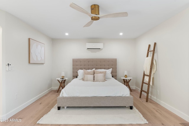 908 W Pershing Ave, Phoenix, AZ 85029 - bedroom featuring light wood-style flooring, a wall mounted air conditioner, a ceiling fan, and recessed lighting
