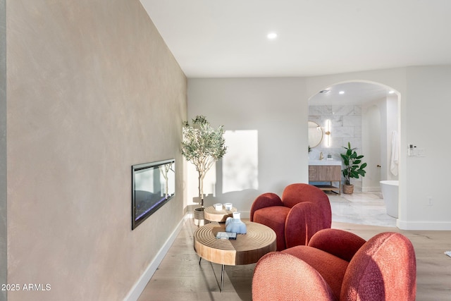 908 W Pershing Ave, Phoenix, AZ 85029 - living area featuring arched walkways, light wood-type flooring, and recessed lighting