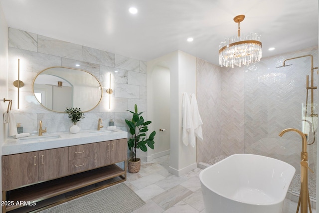 908 W Pershing Ave, Phoenix, AZ 85029 - bathroom featuring double vanity, a freestanding bath, a walk in shower, marble finish floors, and recessed lighting