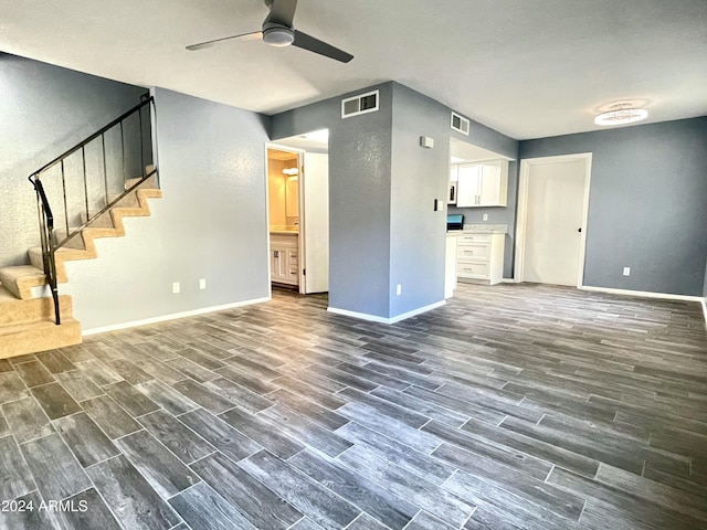 unfurnished living room featuring ceiling fan