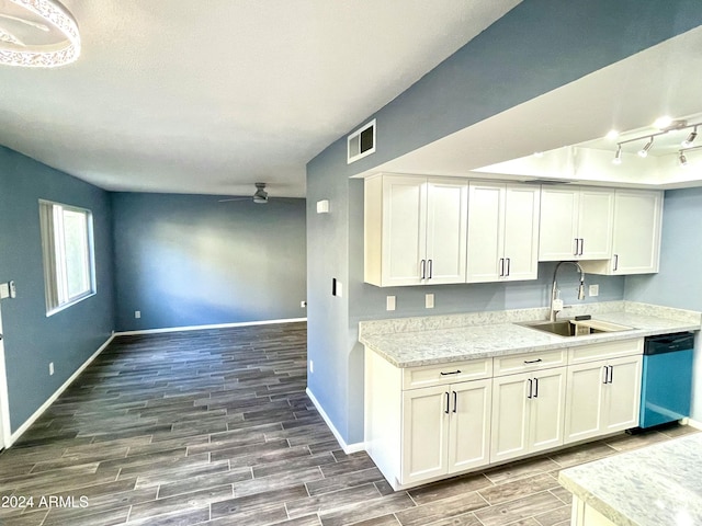 kitchen with light stone counters, ceiling fan, sink, dishwasher, and white cabinetry