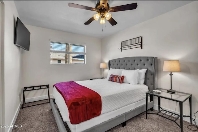 bedroom featuring ceiling fan and dark carpet