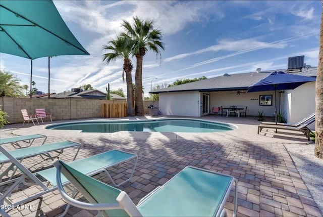 view of pool with a patio and cooling unit