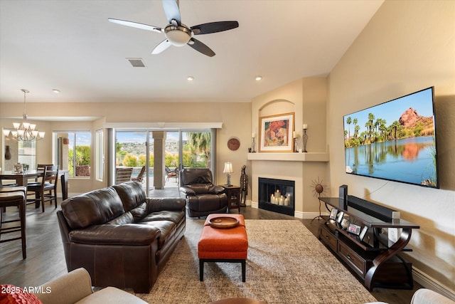 15225 E Golden Eagle Blvd, Fountain Hills, AZ 85268 - living area featuring ceiling fan with notable chandelier, visible vents, wood finished floors, and a glass covered fireplace