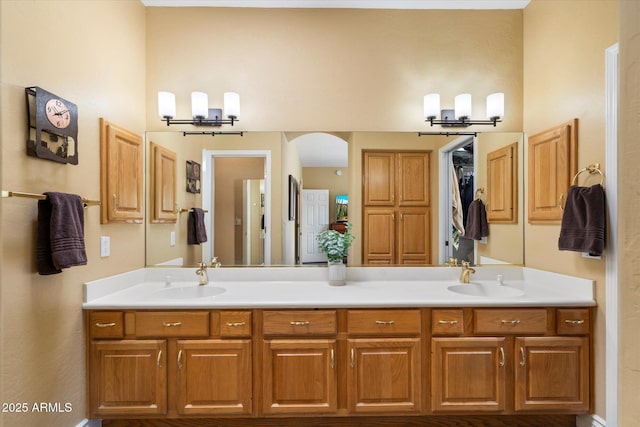 15225 E Golden Eagle Blvd, Fountain Hills, AZ 85268 - bathroom featuring an inviting chandelier, double vanity, and a sink
