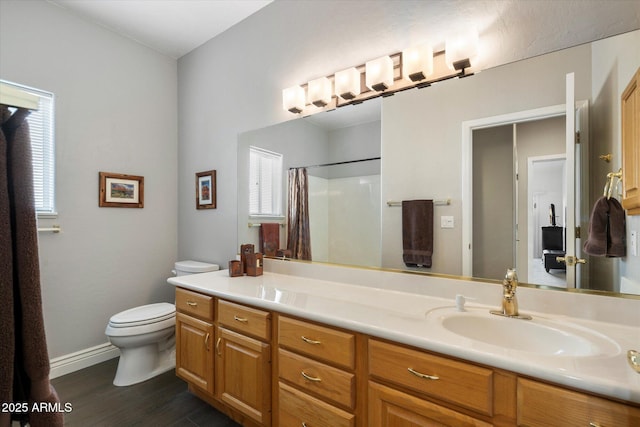 15225 E Golden Eagle Blvd, Fountain Hills, AZ 85268 - full bath with a shower with shower curtain, toilet, vanity, wood finished floors, and baseboards