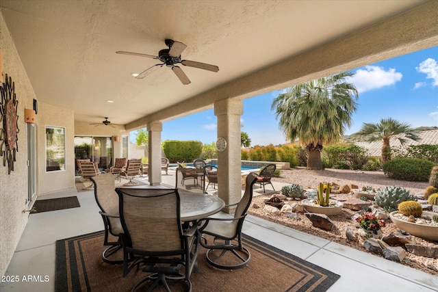 15225 E Golden Eagle Blvd, Fountain Hills, AZ 85268 - view of patio with a fenced in pool, fence, ceiling fan, and outdoor dining space