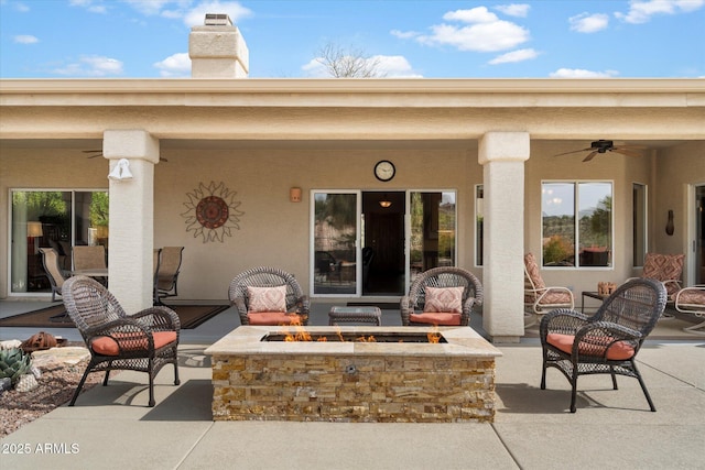 15225 E Golden Eagle Blvd, Fountain Hills, AZ 85268 - view of patio with ceiling fan and an outdoor living space with a fire pit