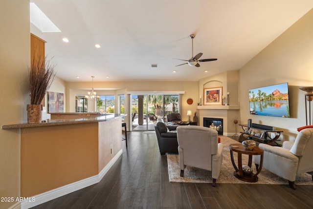 15225 E Golden Eagle Blvd, Fountain Hills, AZ 85268 - living area featuring recessed lighting, dark wood-style flooring, visible vents, a ceiling fan, and a glass covered fireplace