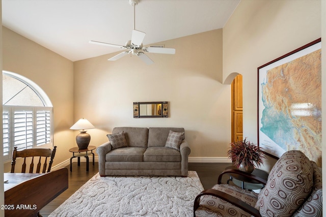 15225 E Golden Eagle Blvd, Fountain Hills, AZ 85268 - living room featuring arched walkways, dark wood-style floors, baseboards, and a ceiling fan