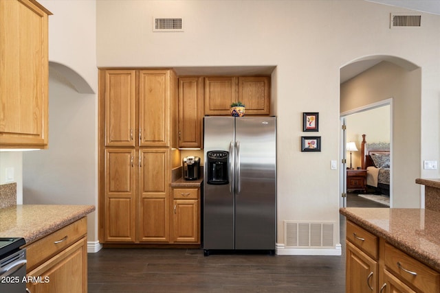15225 E Golden Eagle Blvd, Fountain Hills, AZ 85268 - kitchen with stainless steel fridge with ice dispenser, dark wood-type flooring, arched walkways, and visible vents