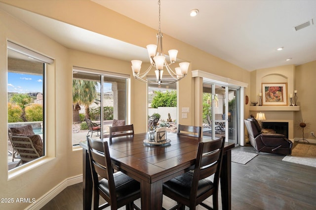 15225 E Golden Eagle Blvd, Fountain Hills, AZ 85268 - dining area with dark wood-style floors, an inviting chandelier, baseboards, visible vents, and a healthy amount of sunlight