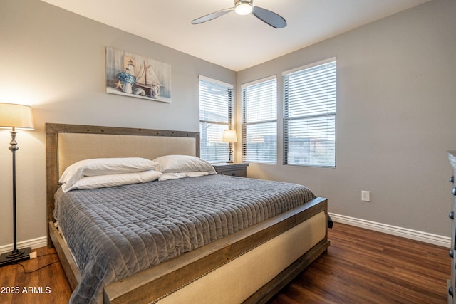 bedroom with a ceiling fan, baseboards, and wood finished floors