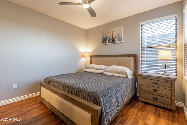 bedroom with baseboards, ceiling fan, and wood finished floors