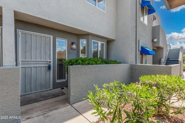 220 N 22nd Pl Unit 1022, Mesa, AZ 85213 - view of exterior entry featuring stucco siding and a balcony