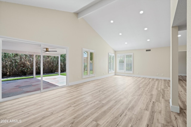 unfurnished living room with high vaulted ceiling, light wood-type flooring, beam ceiling, and ceiling fan