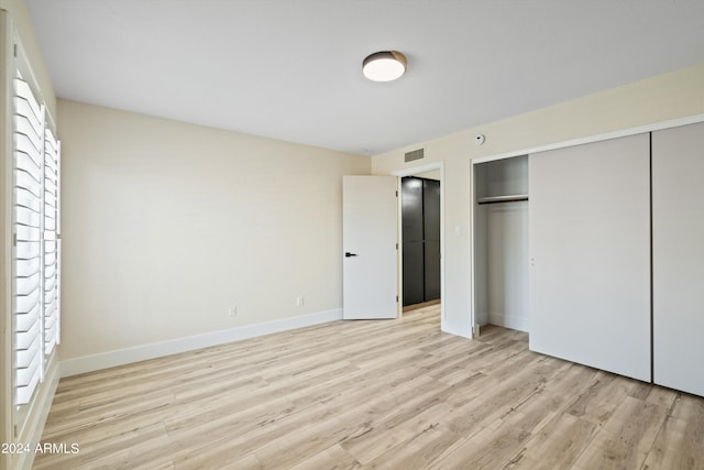 unfurnished bedroom featuring light hardwood / wood-style floors