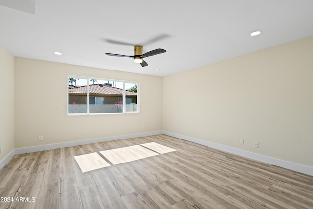 unfurnished room with ceiling fan and light hardwood / wood-style flooring